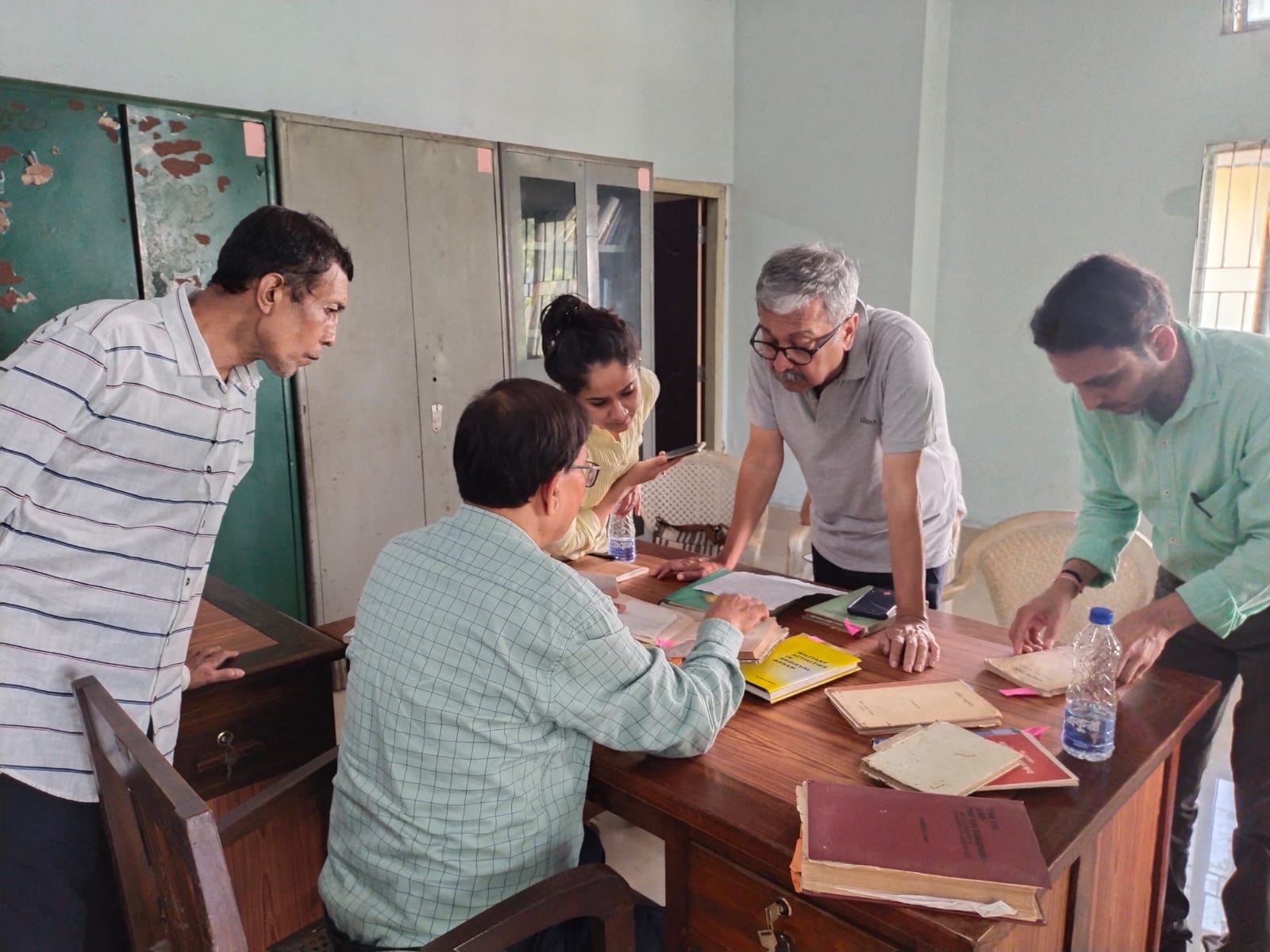 Scholars reviewing documents